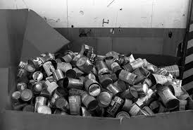 A small pile of cans in a recyclable bin.