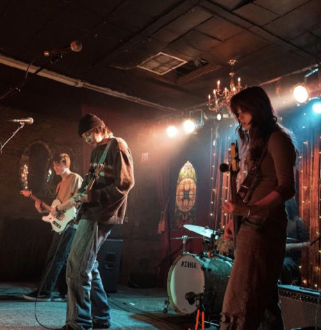 Members of Papercut Party, Caden Abilla (left), Nick Romrell (center), and Liv Anderson (right), playing at Velour Live Music Gallery in Provo, Utah.