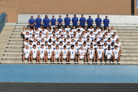 The entire varsity football team alongside the coaching staff at the beginning of the football Season